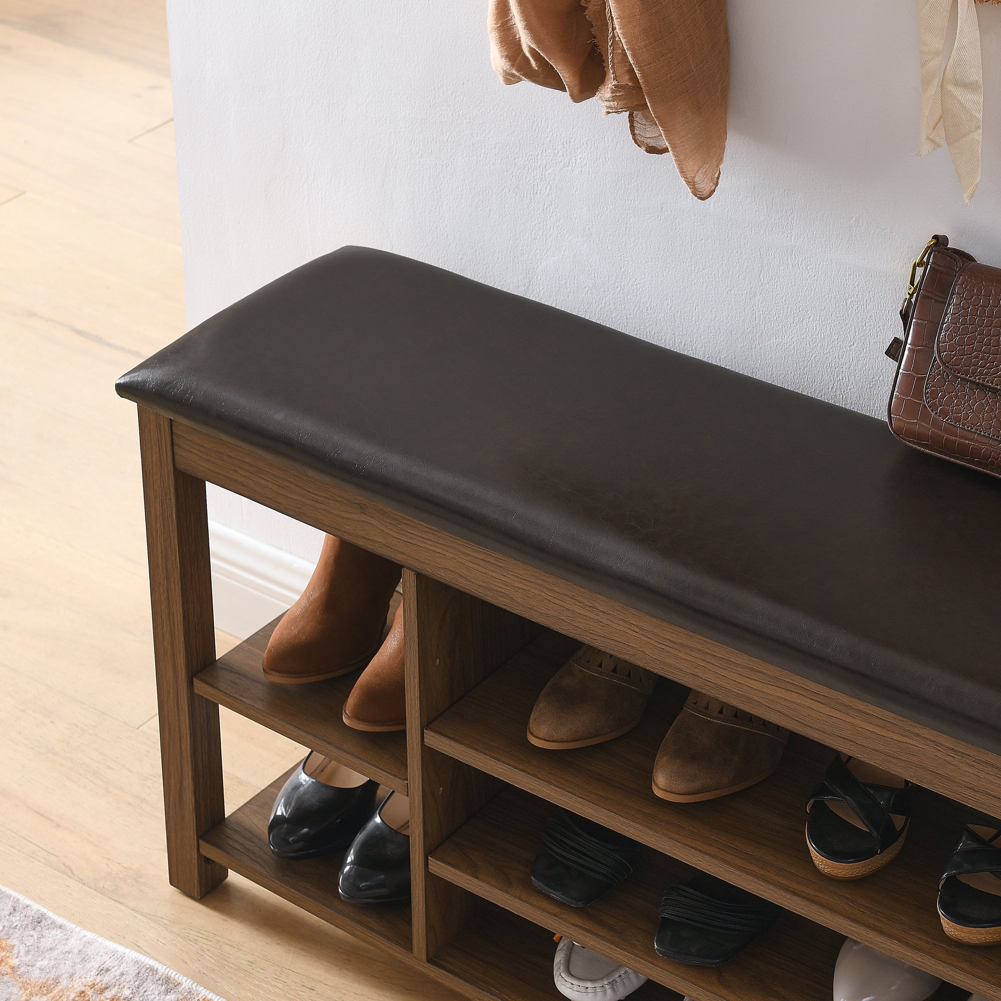 A height-adjustable long shoe-changing bench,made of natural